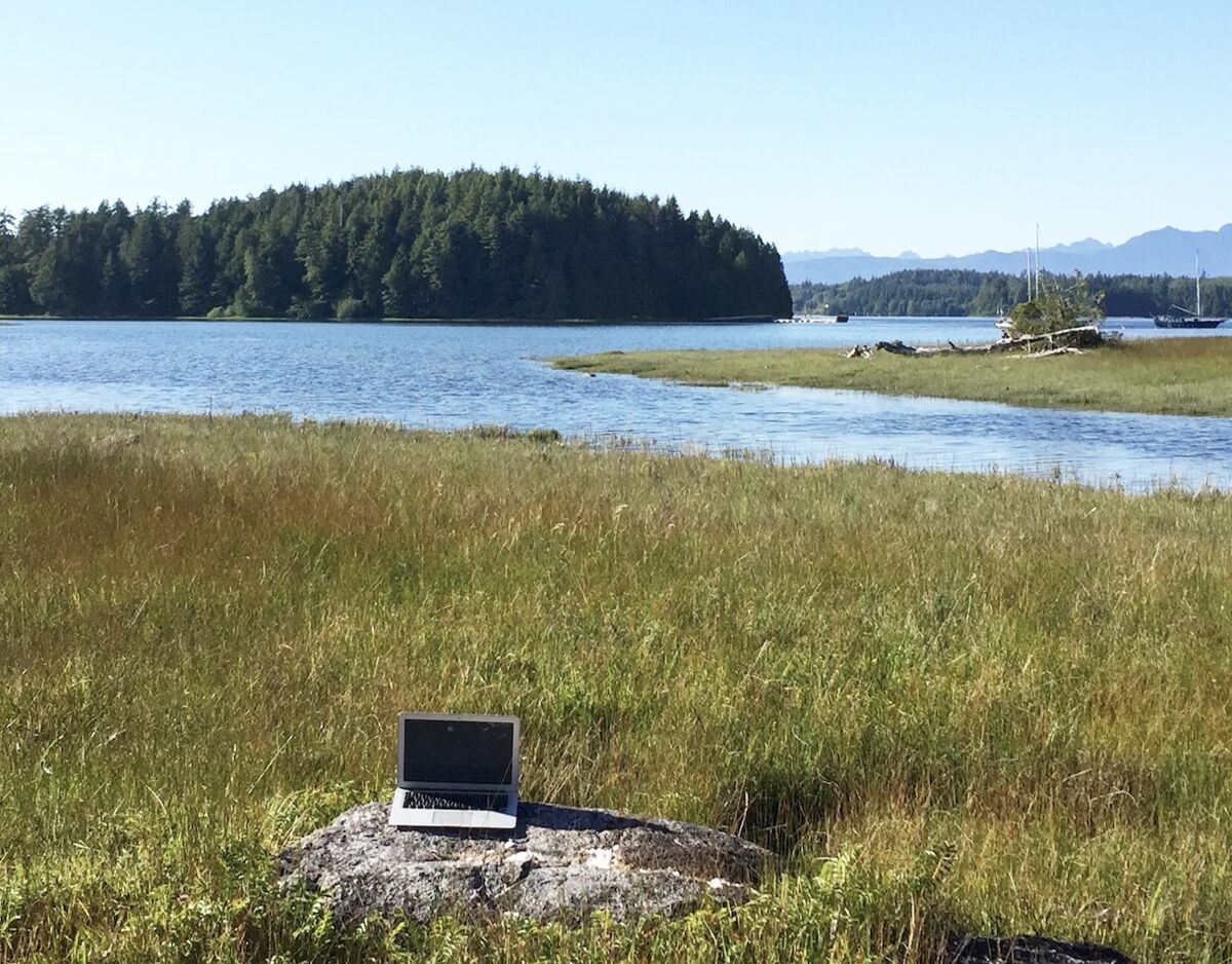 laptop-on-rock-marsh-ucluelet-travel-diary-writing-spot